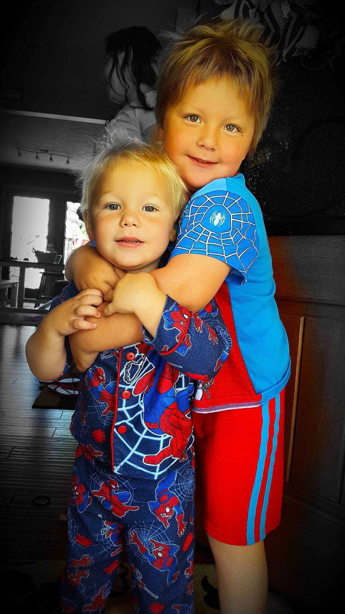 Greyson is registered to the contest to win money with this photo: baby, blue, cheek, child, daughter, eye, face, fun, happy, head, interaction, iris, joy, people, person, sibling, skin, smile, standing, toddler