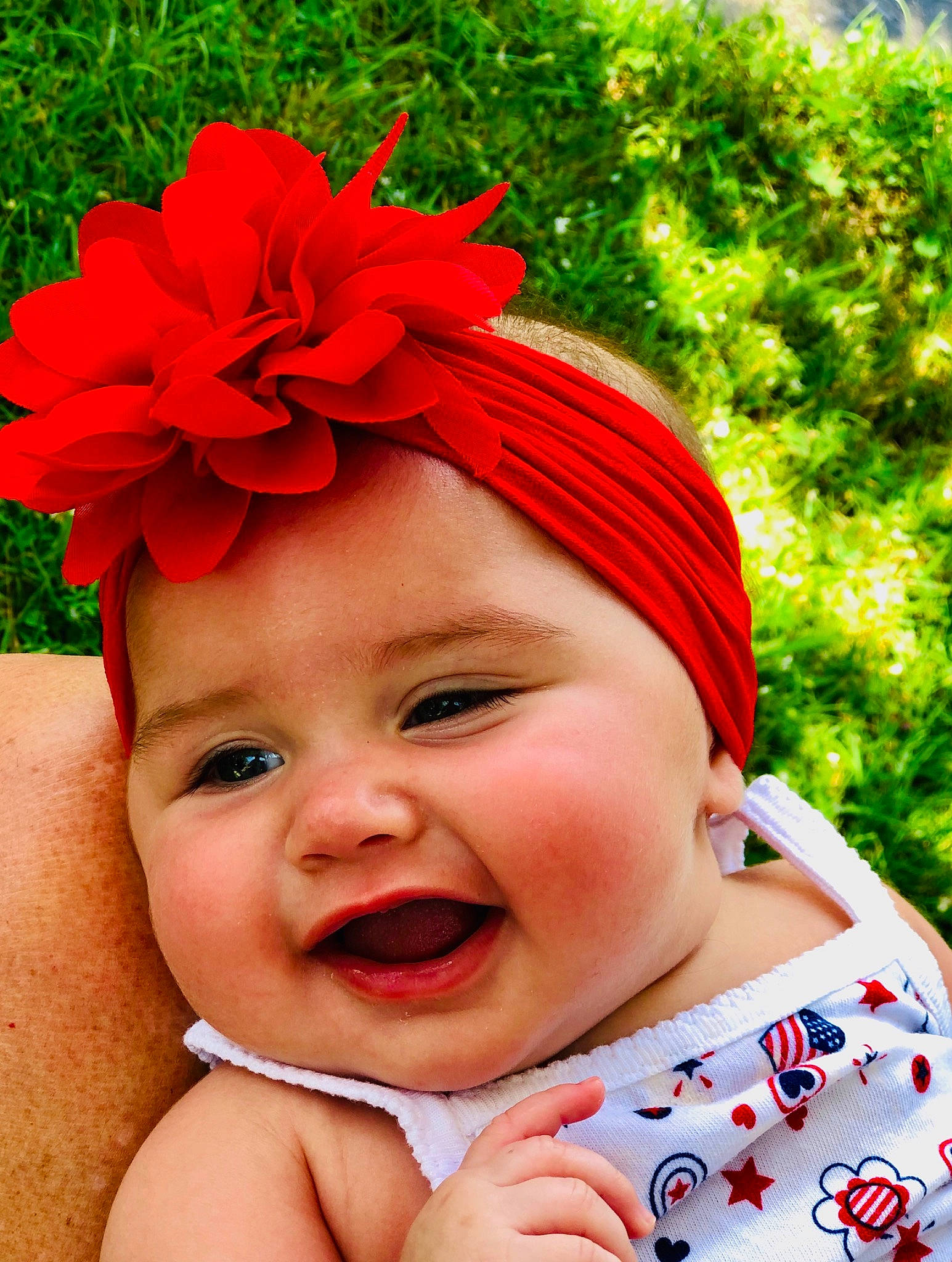 Hadlee joined the competition — help win amazing prizes! baby, baby_products, baby_toddler_clothing, child, clothing, facial_expression, fashion_accessory, hair_accessory, happy, head, headband, headgear, headpiece, headwear, person, petal, photography, plant, product, red