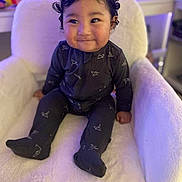 Mercellus Hendson joined the competition — help win amazing prizes! baby, child, smiling, onesie, chair, indoor, cozy, curly_hair, face, person, cute, plush, seated, infant, furniture, soft_lighting, happy, wearing_clothes, home, portrait