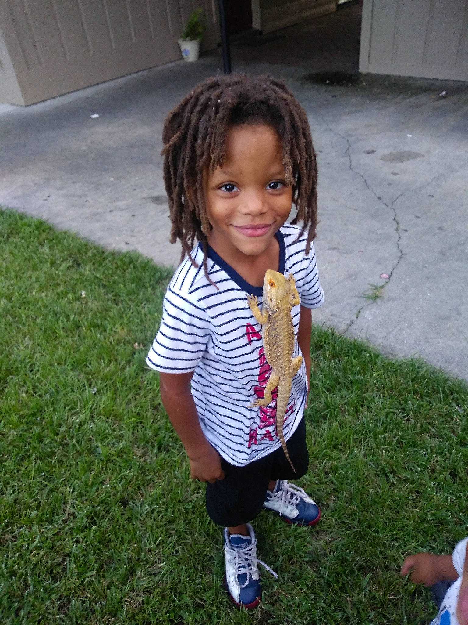 Byron joined the competition — help win amazing prizes! black_hair, child, clothing, cool, day, fun, girl, grass, hair, hairstyle, joy, pattern, person, play, product, smile, toddler, tree