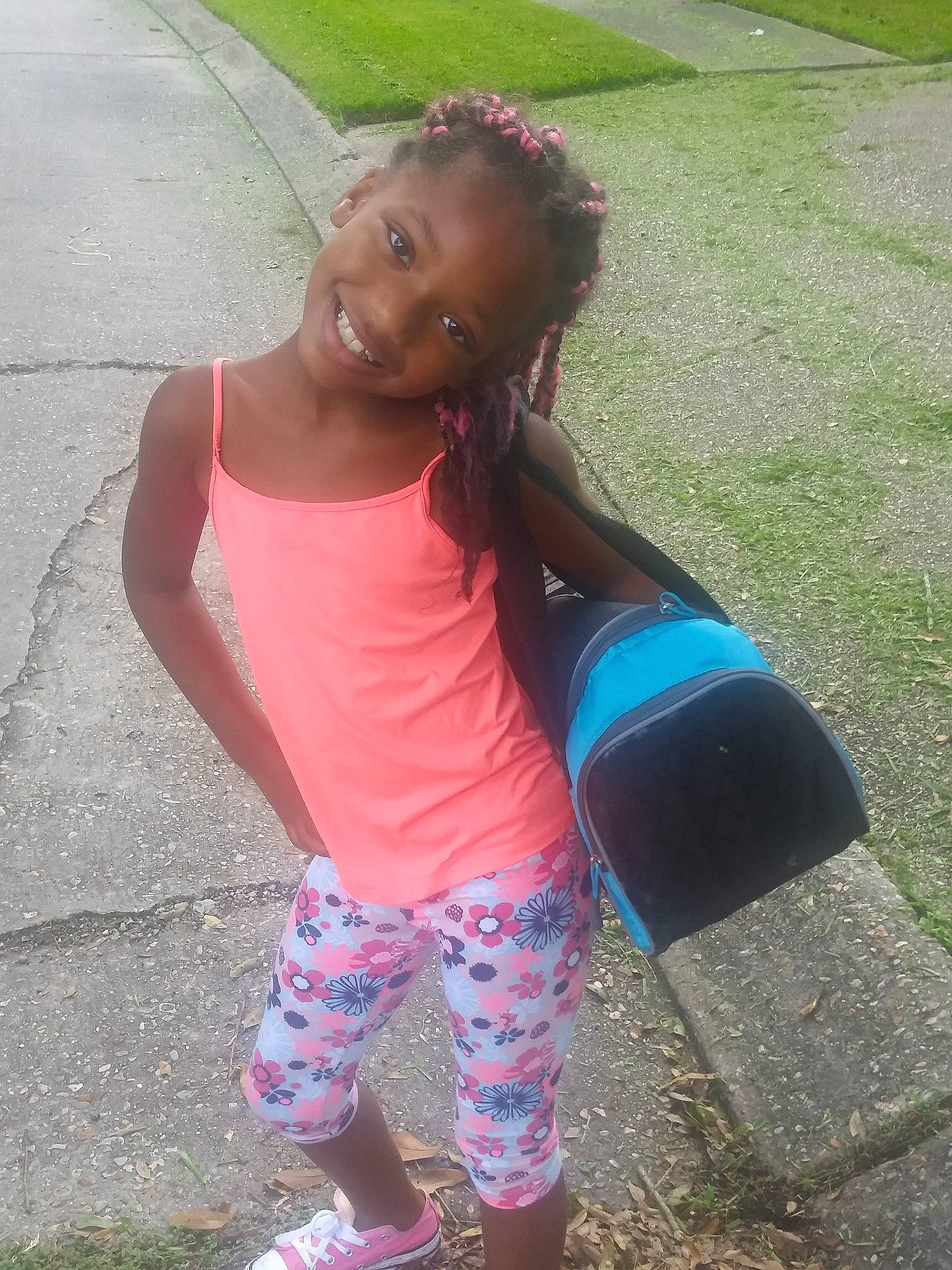 Journee is registered to the contest to win money with this photo: arm, black_hair, child, cool, day, facial_expression, fun, girl, grass, hairstyle, happiness, joy, leg, person, pink, play, shoulder, sitting, smile, summer