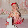 baby, birthday, blue_eyes, carriage, castle, celebration, child, cute, dress, fairy_tale, floral, girl, headband, indoor, number_one, pink, portrait, red_bow, roses, sitting