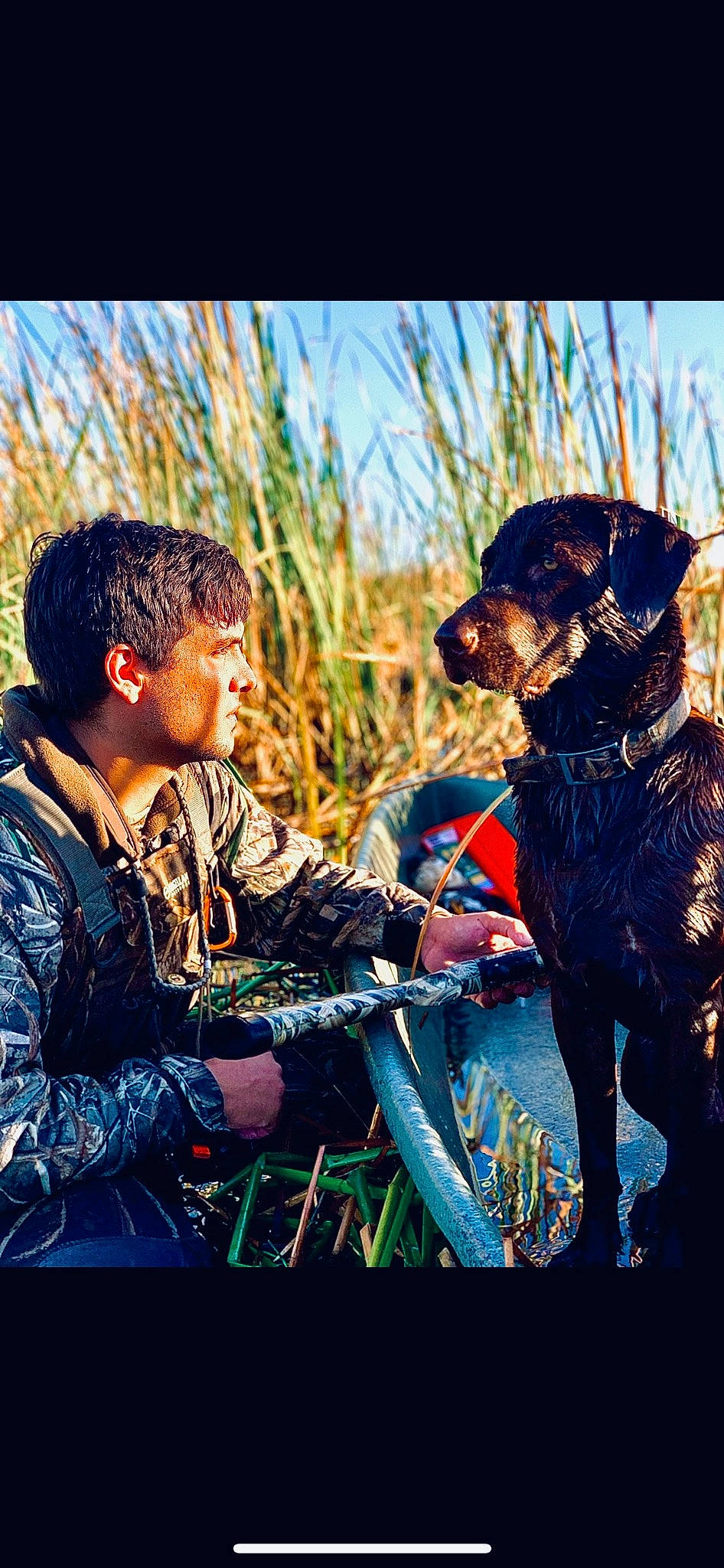 Skye is registered to the contest to win money with this photo: carnivore, companion_dog, dog, dog_breed, grass, grassland, guard_dog, happy, hat, landscape, military_camouflage, military_organization, military_person, people_in_nature, plant, prairie, sky, soldier, sporting_group, working_animal