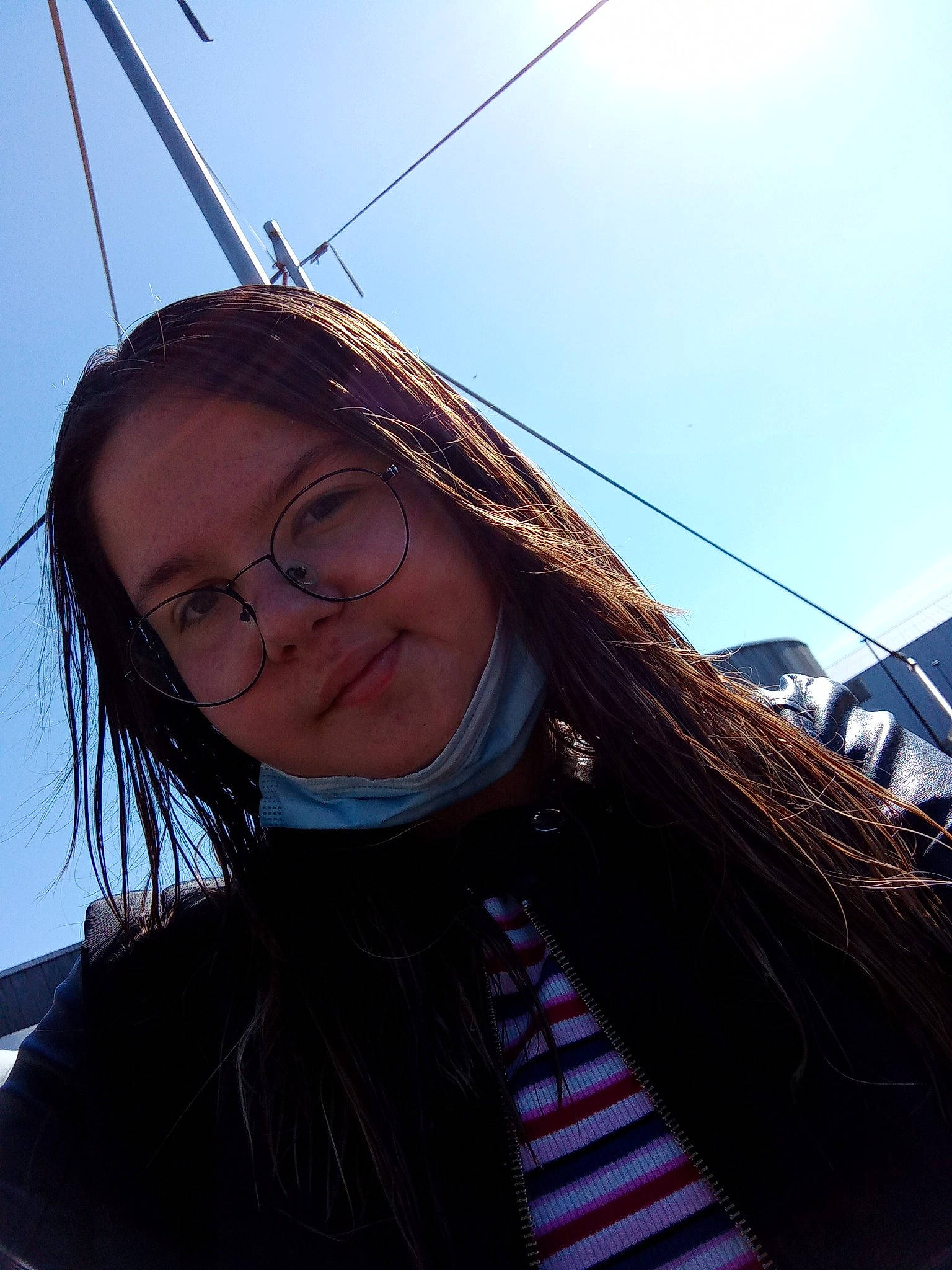 Léa participe au concours pour gagner de l'argent avec cette photo : azure, black_hair, chin, cool, electric_blue, eyebrow, eyewear, fun, glasses, happy, head, joy, lip, long_hair, neck, person, skin, sky, smile, street_fashion