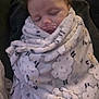 Noelle is registered to the contest to win money with this photo: baby, infant, sleeping, pacifier, blanket, swaddle, cozy, couch, soft_texture, plush, face, portrait, closeup, blanket_pattern, cheeks, nap, indoors, human, wrapped, peaceful