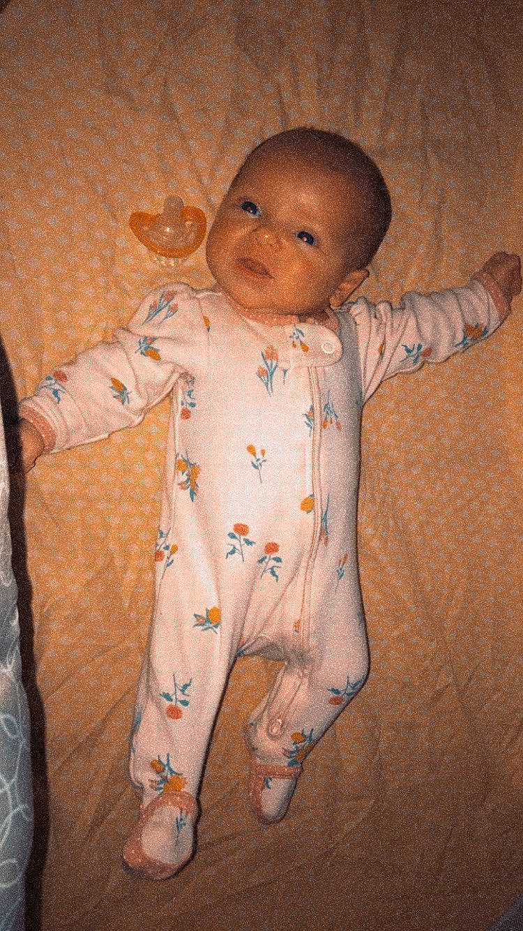 Judith joined the competition — help win amazing prizes! baby, baby_toddler_clothing, barefoot, cheek, chest, child, face, formal_wear, human_body, linens, nightwear, nose, pattern, peach, person, room, sitting, sleeve, textile, toddler