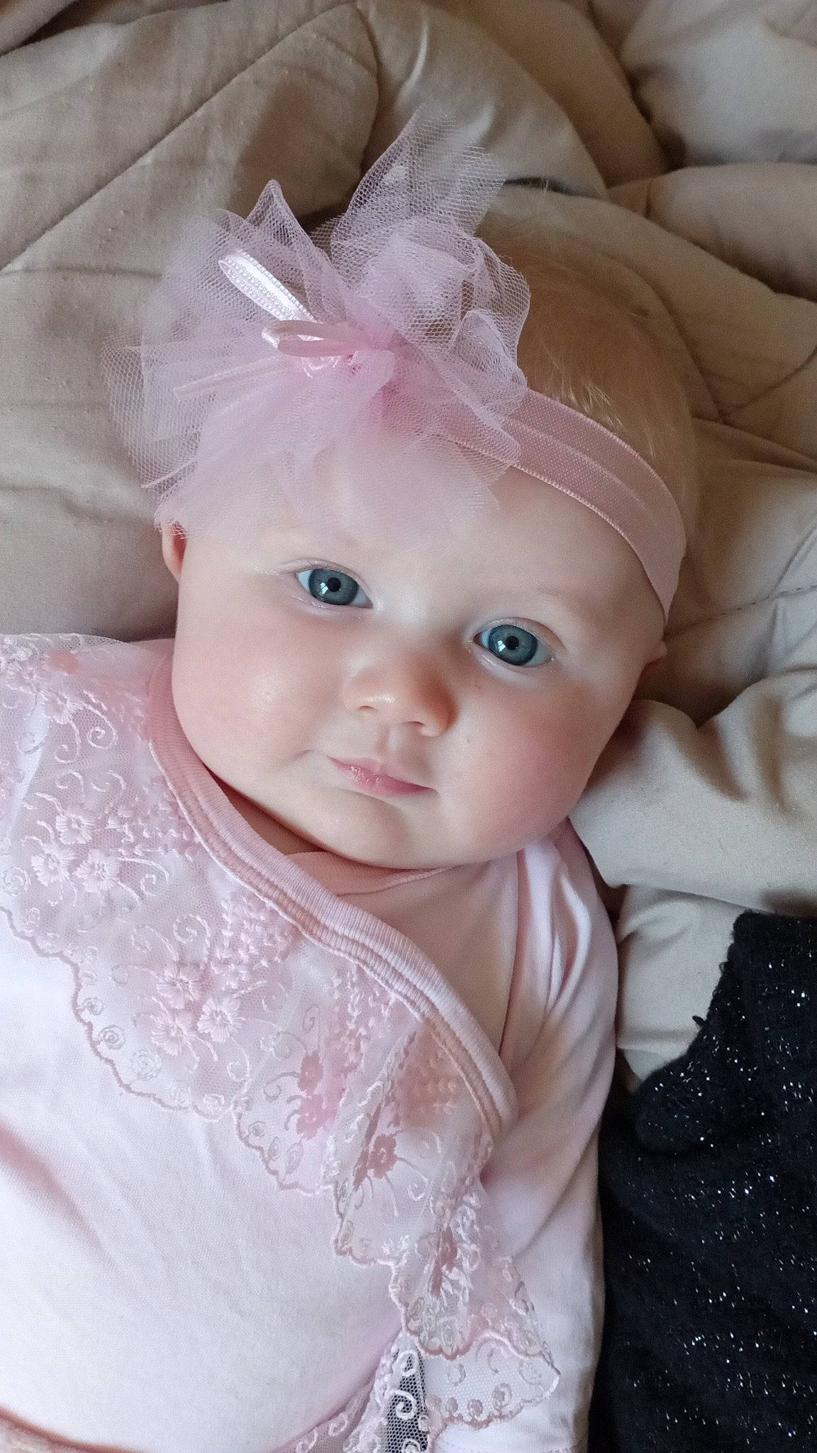 Angéline participe au concours pour gagner de l'argent avec cette photo : baby, baby_toddler_clothing, cheek, doll, dress, eye, eyebrow, eyelash, face, hand, happy, head, headgear, human_body, iris, lip, person, pink, skin, sleeve