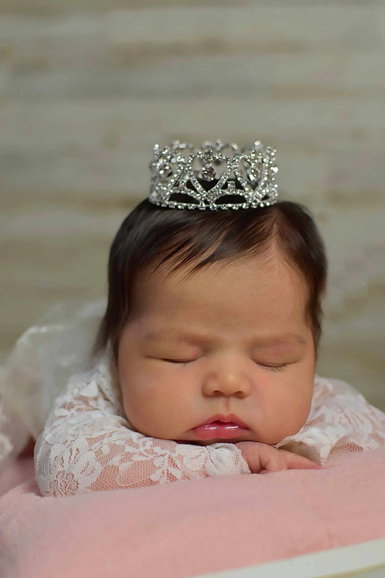 Anari joined the competition — help win amazing prizes! baby, sleeping, crown, lace, pink_blanket, closeup, infant, peaceful, cute, portrait, head, face, hand, soft_texture, newborn, resting, adorable, indoor, child, sleep