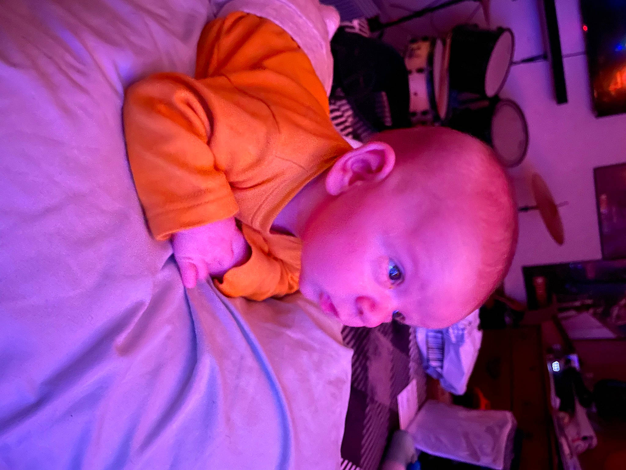 Tristan is registered to the contest to win money with this photo: baby, child, electric_blue, entertainment, event, fun, hat, magenta, mouth, orange, performance, person, pink, public_event, purple, room, toddler, violet