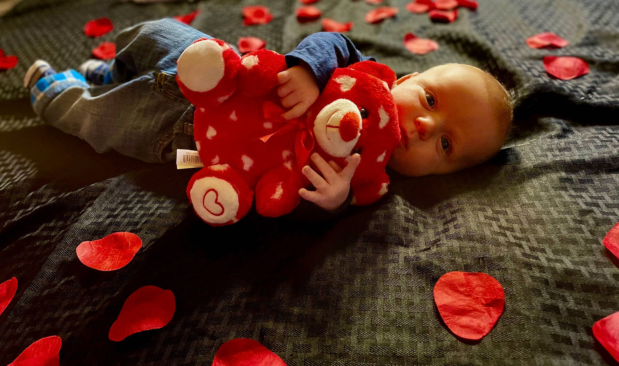 Tristan joined the competition — help win amazing prizes! baby, baby_products, baby_toys, carmine, cheek, child, coquelicot, doll, fictional_character, flooring, nail, orange, person, plastic, red, stuffed_toy, textile, toddler, toy, tree