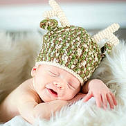 Dante is registered to the contest to win money with this photo: beanie, bonnet, cap, child, crochet, ear, fur, hair_accessory, headgear, infant, knit_cap, product, toddler
