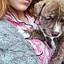 Blu is registered to the contest to win money with this photo: puppy, dog, person, pajamas, blanket, cuddle, close_up, brown, white, fur, paw, face, sleepy, cozy, indoors, soft, warm, comfort, relaxation, human