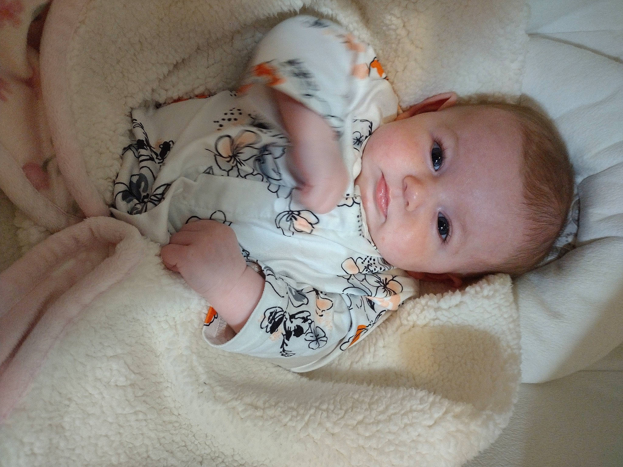 Julianna joined the competition — help win amazing prizes! baby, baby_products, baby_sleeping, baby_toddler_clothing, bedtime, cheek, child, comfort, eye, face, iris, linens, lip, pattern, person, room, sitting, skin, sleeve, textile