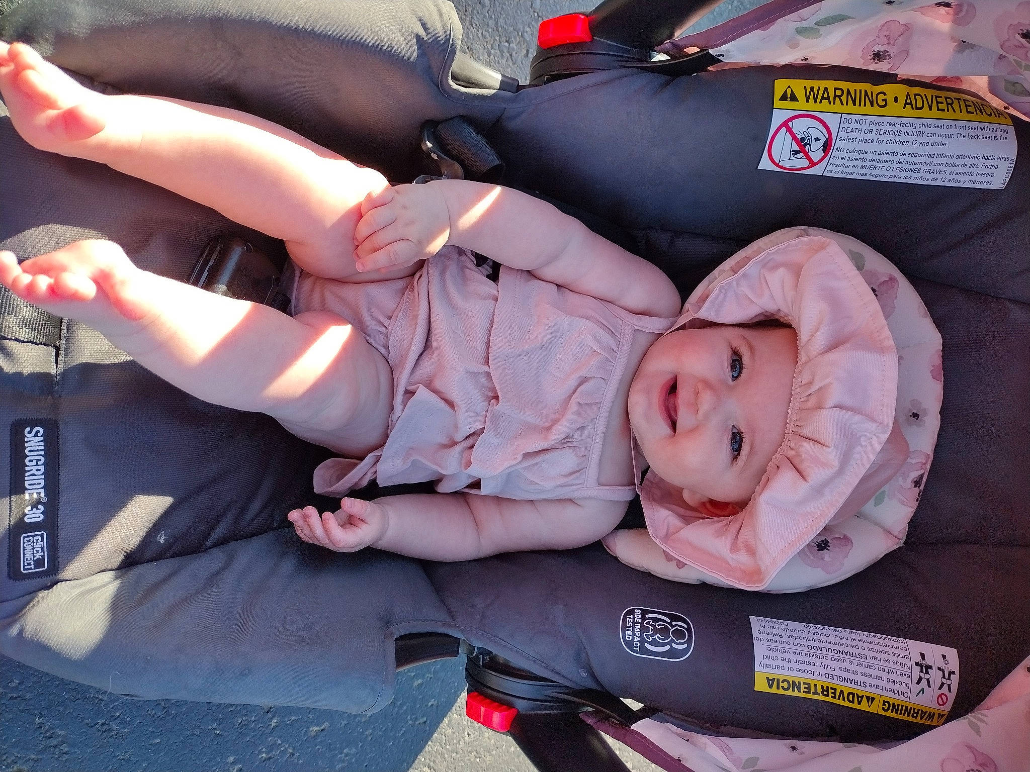 Julianna is registered to the contest to win money with this photo: auto_part, baby, baby_carriage, baby_products, baby_safety, baby_toddler_clothing, child, comfort, elbow, foot, fun, gesture, headwear, human_leg, joy, lap, person, sitting, thigh, toddler
