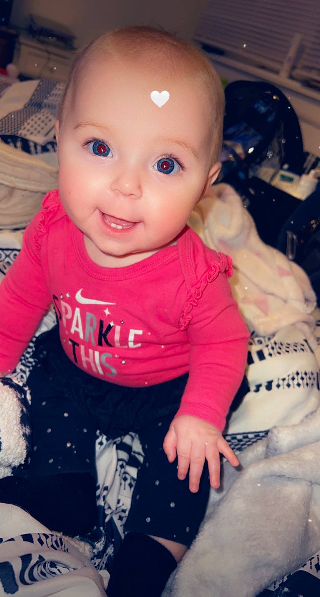 Serenity is registered to the contest to win money with this photo: arm, baby_toddler_clothing, cheek, chin, facial_expression, finger, gesture, hand, human_body, joint, lip, mouth, nose, person, pink, skin, sleeve, smile, standing, textile