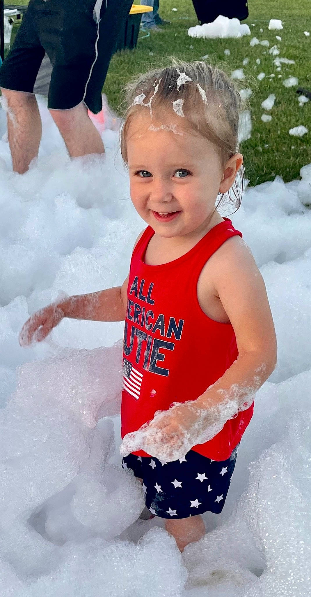 Maci is registered to the contest to win money with this photo: baby, baby_toddler_clothing, blue, child, face, facial_expression, fun, gesture, happy, joy, leisure, person, photograph, pink, red, sleeve, smile, standing, summer, toddler
