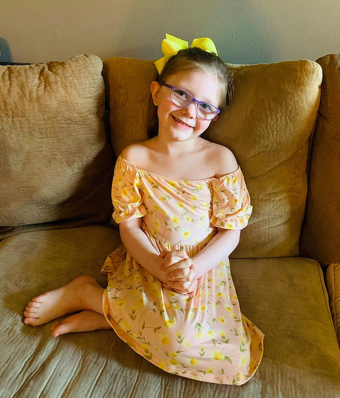 Mya is registered to the contest to win money with this photo: arm, comfort, couch, day_dress, dress, eye, face, fashion_design, flash_photography, glasses, happy, head, human_body, joy, person, shoulder, sleeve, smile, textile, thigh
