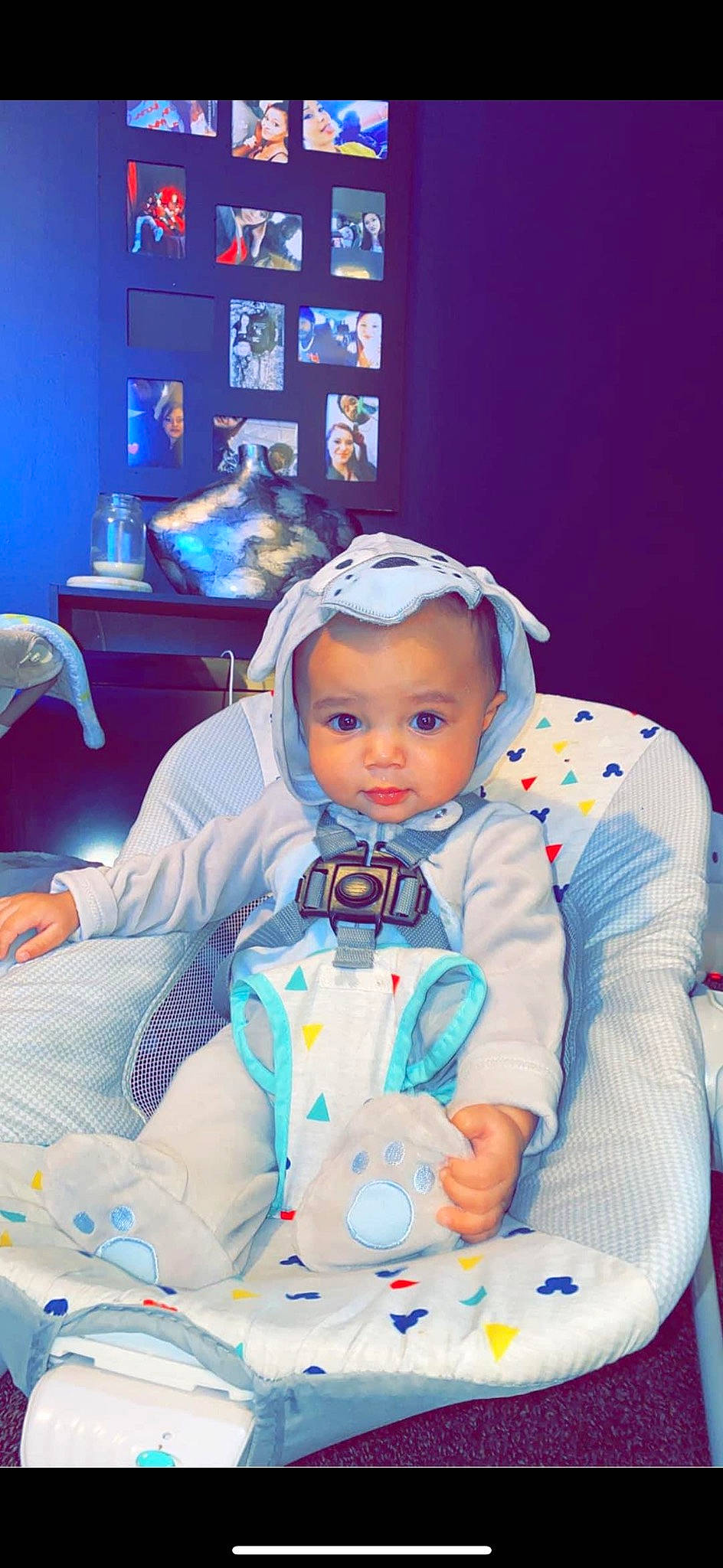 Prince is registered to the contest to win money with this photo: baby, baby_products, baby_toddler_clothing, bib, chair, child, comfort, electric_blue, event, fun, happy, joy, leisure, outerwear, person, picture_frame, purple, room, sitting, toddler