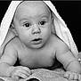 baby, towel, black_and_white, infant, portrait, curious, face, skin, eyes, hands, lying_down, texture, closeup, expression, cute, child, newborn, soft_light, monochrome, background