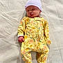 Mary-Alice is registered to the contest to win money with this photo: newborn, baby, sleeping, onesie, floral_pattern, hat, blanket, infant, peaceful, cozy, clothing, soft_texture, portrait, child, resting, cute, indoors, young_child, sleep, relaxation