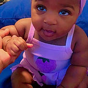 Xamira joined the competition — help win amazing prizes! baby, child, purple_headband, blue_cushion, holding_hand, indoor, cute, smiling, infant, playful, person, portrait, colorful_emojis, heart_emoji, skin, face, sitting, clothing, hand, tongue_out