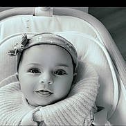 Leana participe au concours pour gagner de l'argent avec cette photo : baby, infant, headband, smiling, face, portrait, cozy, knitted_sweater, baby_seat, cushion, cute, child, happy, indoors, black_and_white, closeup, young, person, soft, comfortable