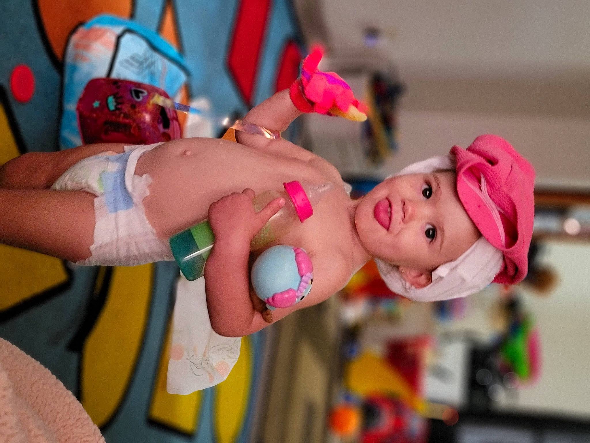 Rae is registered to the contest to win money with this photo: abdomen, animation, chest, child, costume, event, fun, happy, hat, headgear, headwear, leisure, muscle, navel, orange, peach, person, pink, room, toy