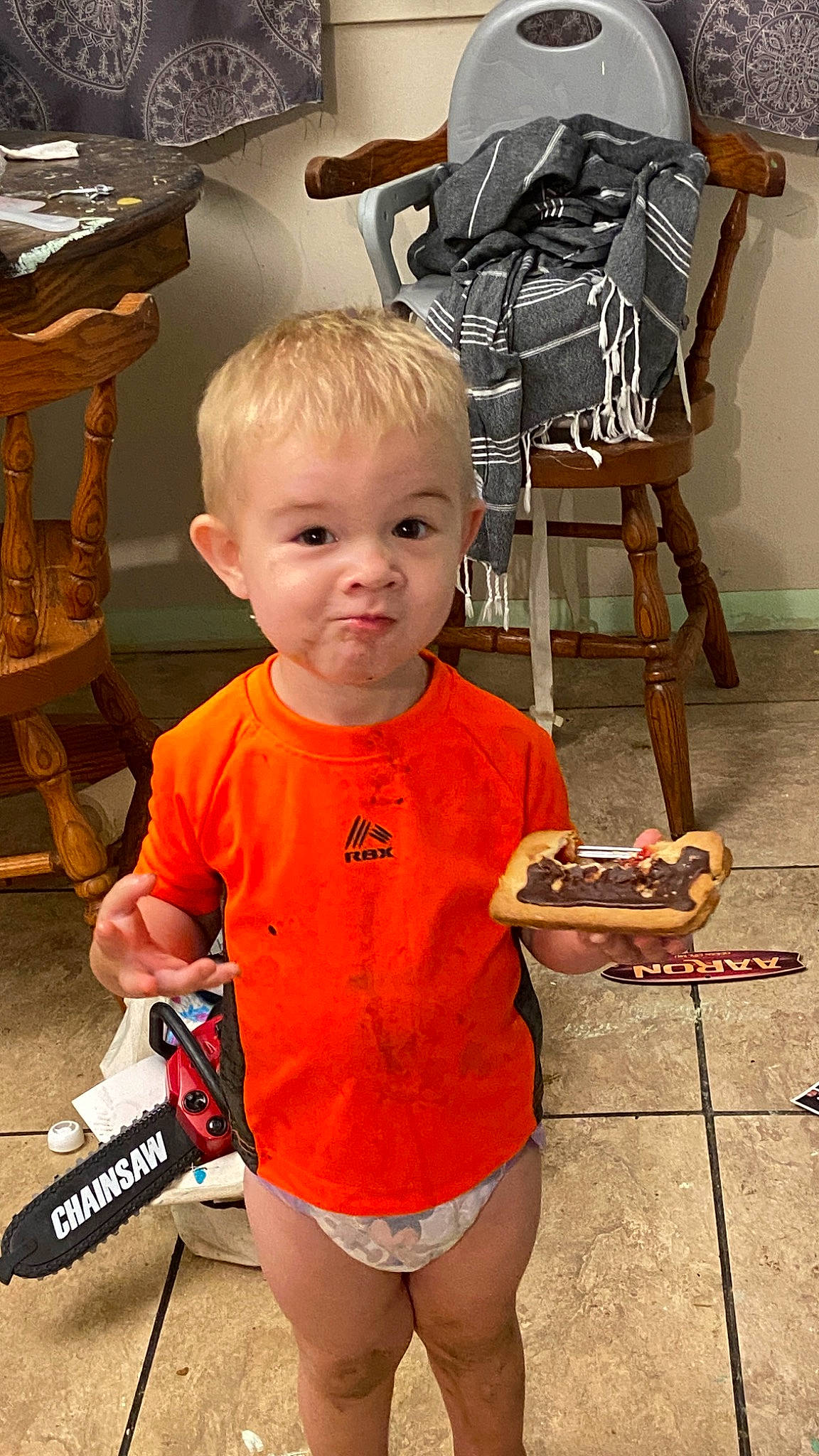 Winter joined the competition — help win amazing prizes! baby, backpack, bag, chair, child, eyewear, flooring, fun, human_leg, joint, luggage_and_bags, orange, person, shorts, sitting, sleeve, t_shirt, thigh, toddler, vacation