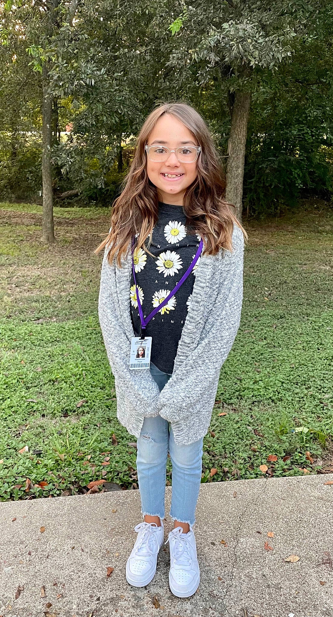 Mackenzee is registered to the contest to win money with this photo: blond, brown_hair, denim, electric_blue, fashion_design, grass, human_leg, joy, knee, long_hair, neck, pattern, people_in_nature, person, plant, shoulder, sleeve, smile, street_fashion, thigh