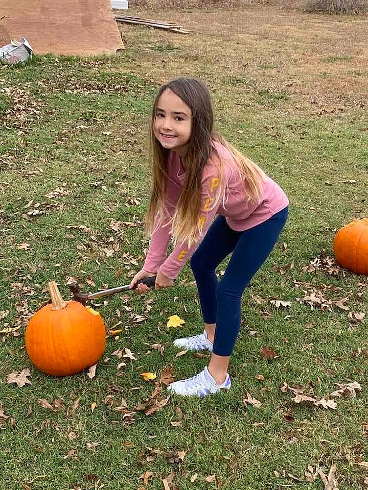 Mackenzee is registered to the contest to win money with this photo: beauty, calabaza, cucurbita, facial_expression, fruit, gourd, grass, happy, joy, lawn, local_food, natural_foods, orange, people_in_nature, person, plant, pumpkin, smile, squash, vegetable