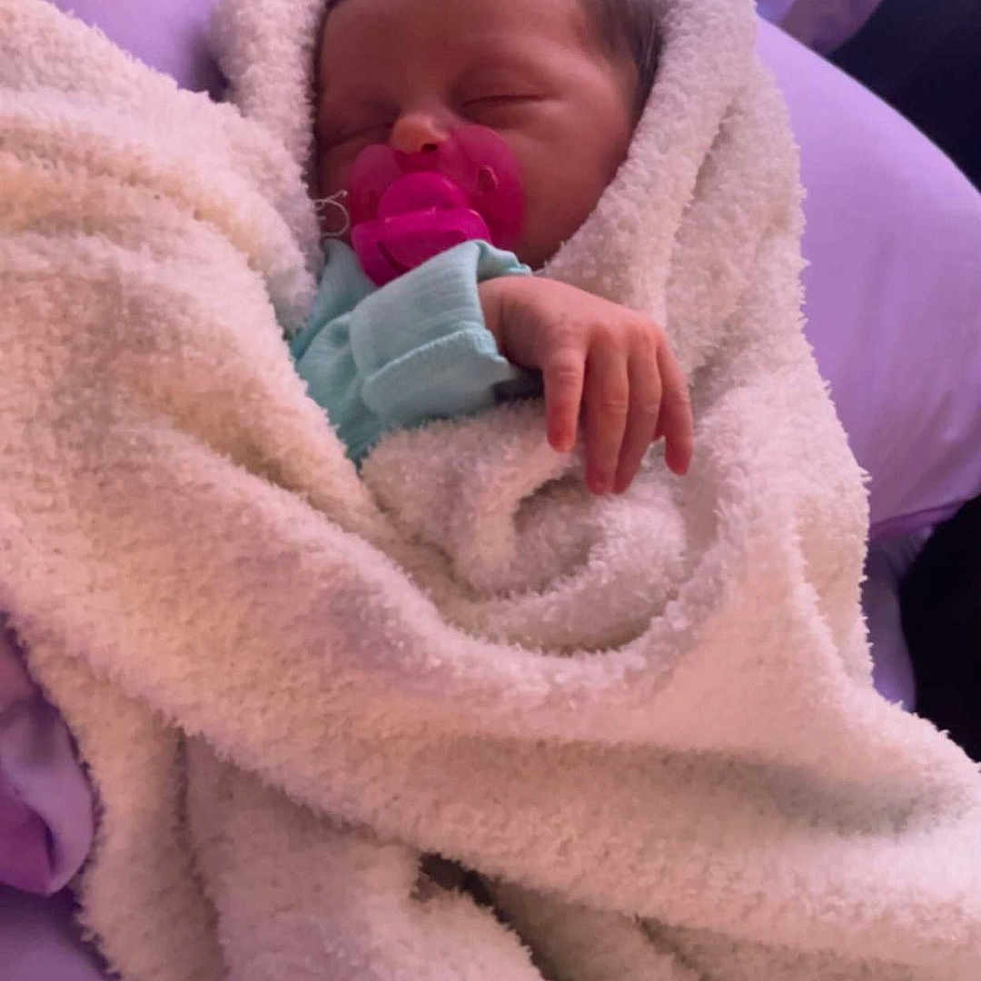 Leah joined the competition — help win amazing prizes! architecture, baby, blanket, building, face, head, hospital, newborn, person, photography, portrait, quilt, sleeping, towel