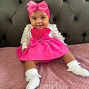 Amelia-Rose joined the competition — help win amazing prizes! baby, child, pink_dress, headband, bow, smile, sitting, blanket, white_socks, indoor, portrait, cute, toddler, happy, headwear, fabric, furniture, person, closeup, infant