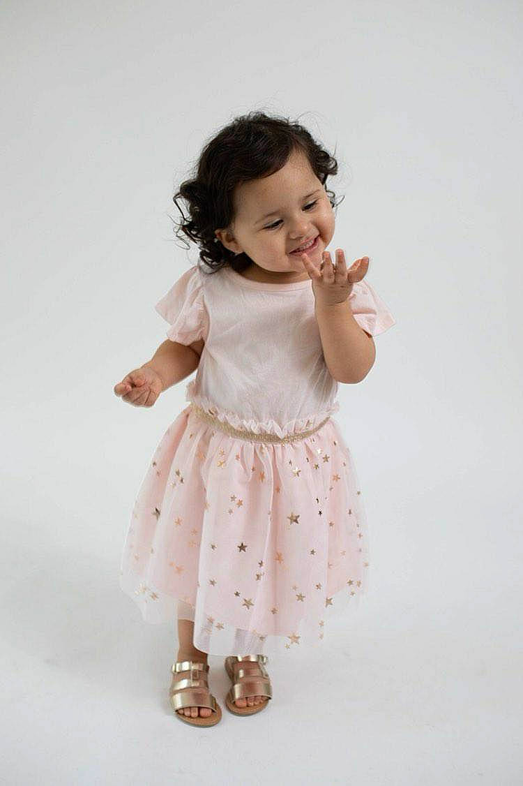 Alessandra joined the competition — help win amazing prizes! baby, beige, child, child_model, dress, footwear, gesture, hand, joint, joy, pattern, person, photography, pink, shoe, skin, sleeve, standing, toddler, white