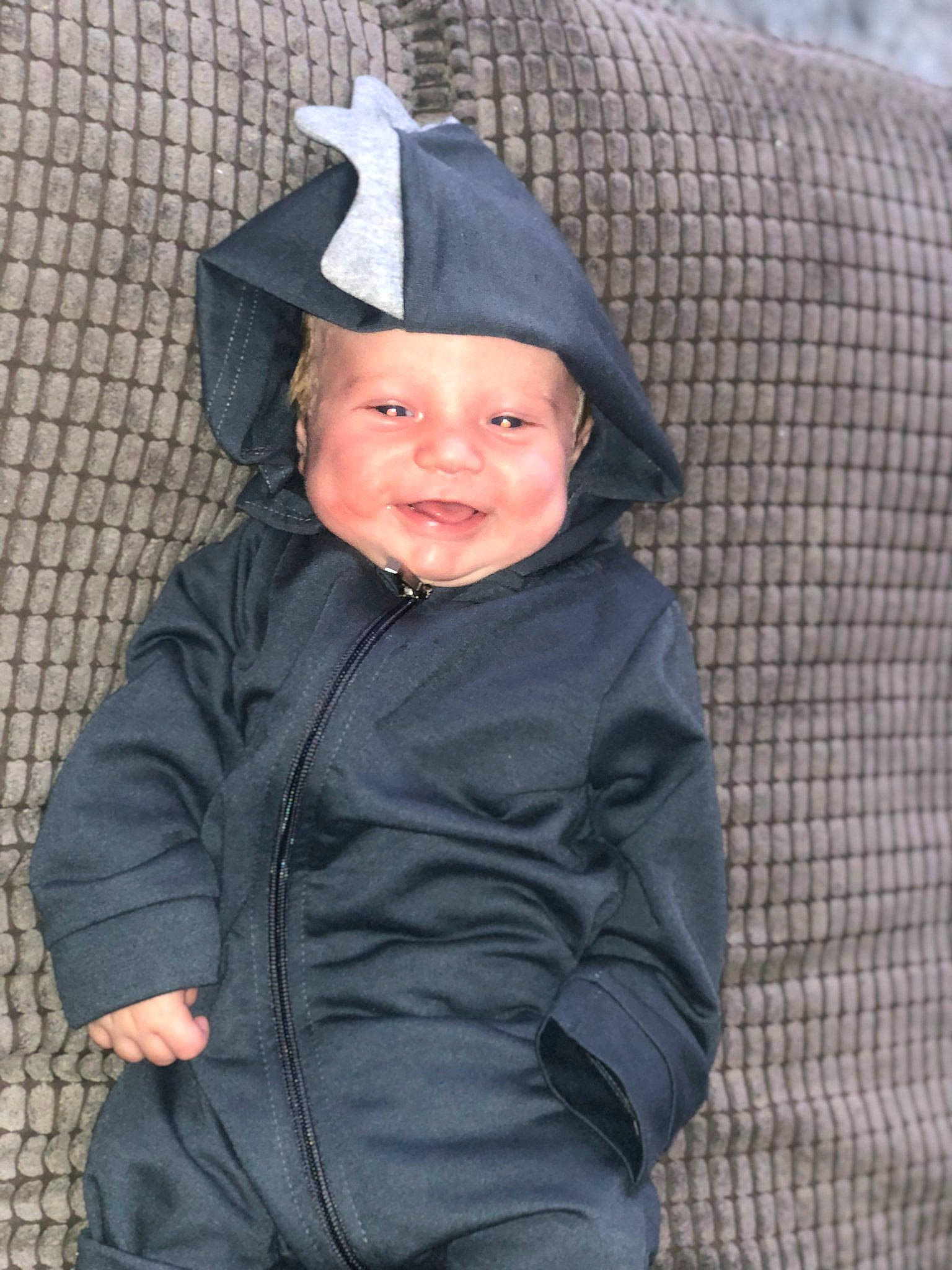 Curt is registered to the contest to win money with this photo: baby, child, headgear, outerwear, person, smile, toddler