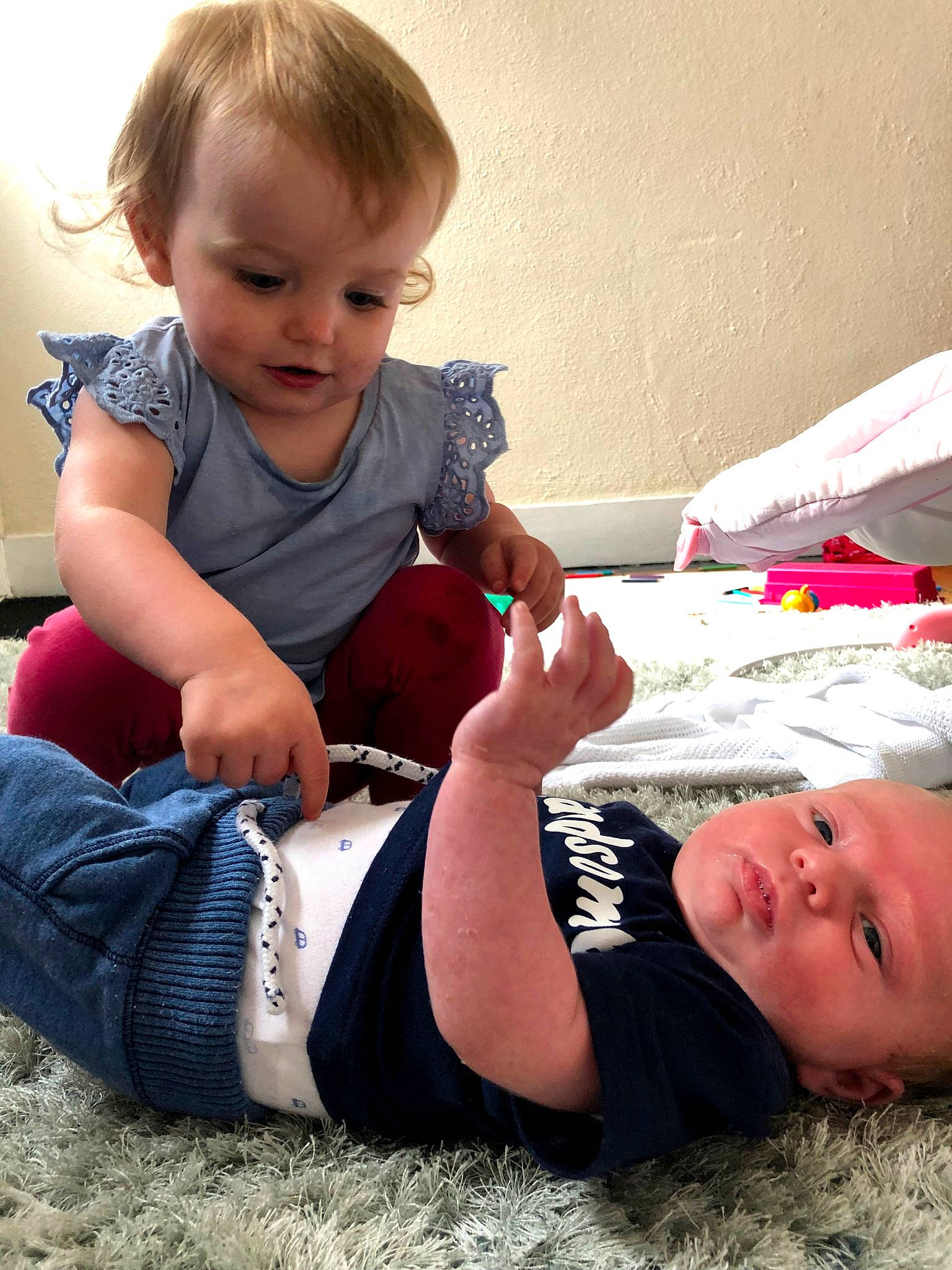 Curt joined the competition — help win amazing prizes! arm, baby, child, elbow, finger, lap, leg, person, play, sibling, sitting, toddler