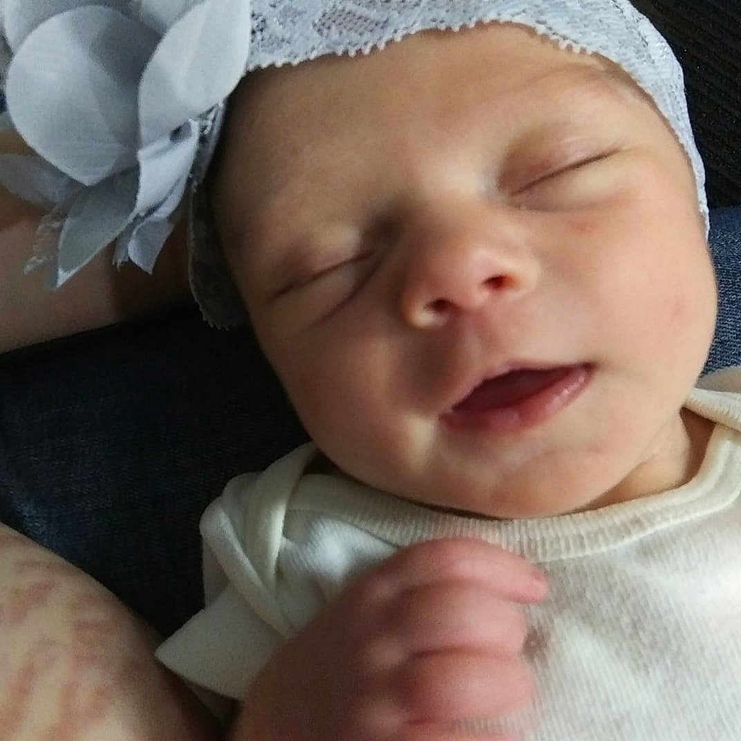 Viviana is registered to the contest to win money with this photo: baby, baby_sleeping, birth, cheek, child, face, fashion_accessory, hair_accessory, hand, head, headband, headgear, lip, mouth, nose, person, skin, smile, toddler