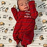 baby, infant, onesie, red_clothing, socks, gray_socks, blanket, winnie_the_pooh, cartoon_characters, cute, lying_down, indoor, portrait, child, newborn, soft_texture, smiling, baby_clothes, cozy, face