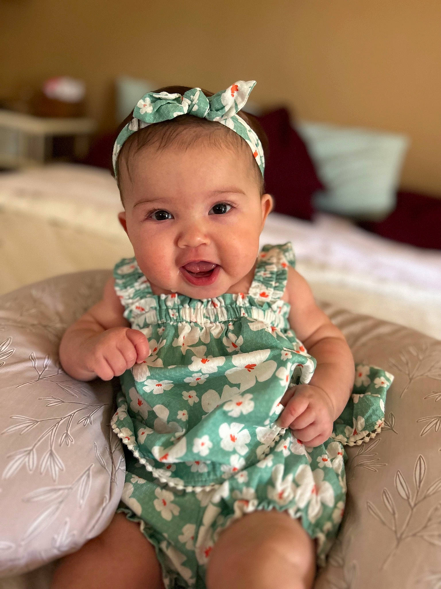 Olivia joined the competition — help win amazing prizes! baby, baby_toddler_clothing, cap, cheek, child, embellishment, fashion_accessory, happy, headband, headgear, headpiece, iris, jewellery, necklace, pattern, person, sitting, skin, sleeve, smile