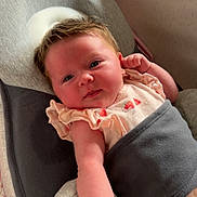 Elsie joined the competition — help win amazing prizes! baby, infant, face, arm, baby_seat, clothing, pink, cushion, skin, person, child, cute, newborn, indoor, soft_lighting, portrait, resting, looking_at_camera, young, adorable