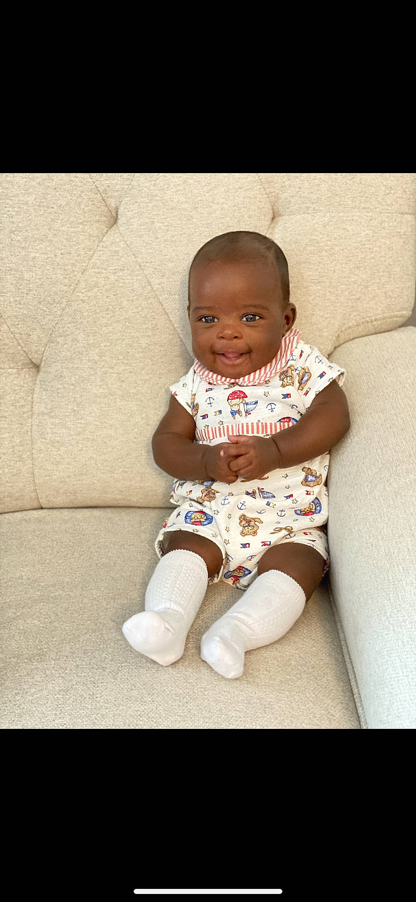 Konnor is registered to the contest to win money with this photo: baby, baby_toddler_clothing, cheek, child, comfort, eye, flash_photography, floor, flooring, happy, head, human_body, human_leg, iris, knee, person, skin, sleeve, smile, textile