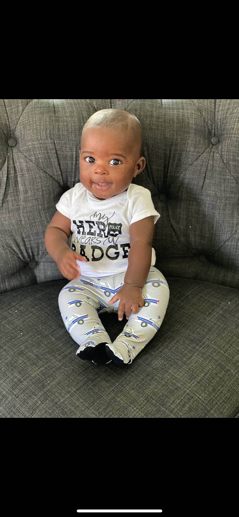 Konnor joined the competition — help win amazing prizes! baby, baby_toddler_clothing, cheek, child, comfort, cool, eye, flash_photography, floor, flooring, grass, happy, head, human_leg, knee, person, sitting, sleeve, smile, t_shirt