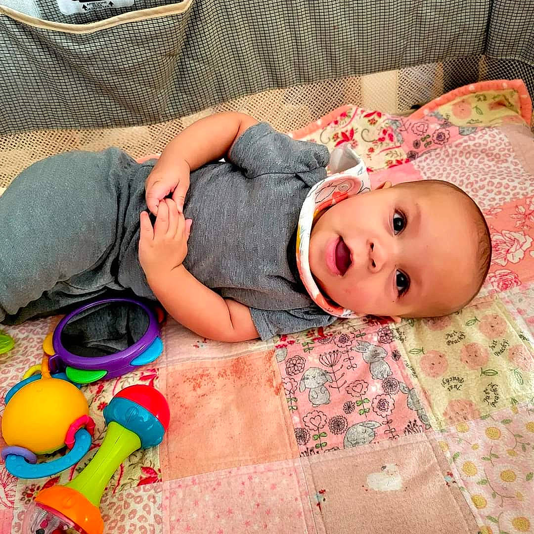 Naomi joined the competition — help win amazing prizes! baby, baby_products, baby_toddler_clothing, bedding, bedtime, child, comfort, flooring, fun, grass, happy, linens, mammal, pattern, people, person, room, sitting, sleep, toddler