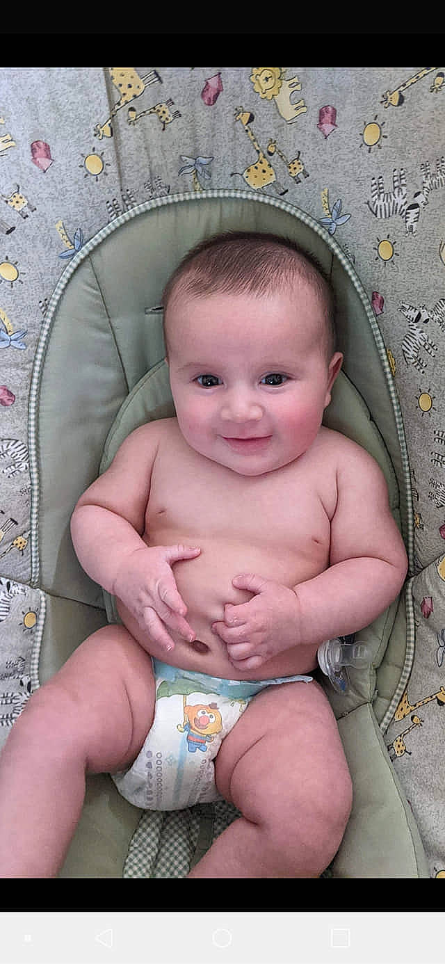 Devin is registered to the contest to win money with this photo: baby, baby_toddler_clothing, cheek, chest, child, chin, eye, face, hairstyle, happy, head, iris, joy, leg, person, pink, skin, smile, stomach, thigh