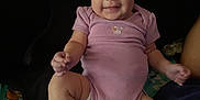 Amora joined the competition — help win amazing prizes! baby, infant, smiling, purple_onesie, diaper, sitting, blanket, happy, cute, child, person, indoor, skin, face, legs, arms, expression, cozy, playful, young