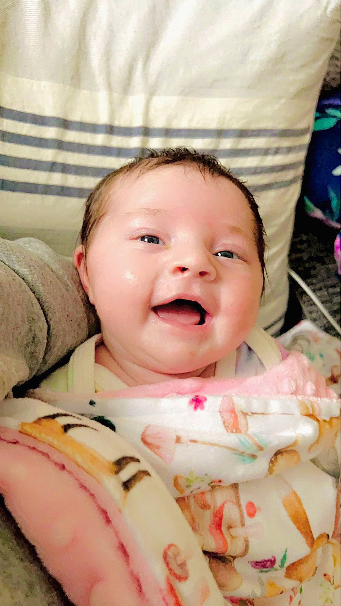 Kaddelyn is registered to the contest to win money with this photo: baby, baby_toddler_clothing, cheek, child, chin, comfort, event, face, finger, fun, happy, head, linens, lip, mouth, person, pink, skin, smile, sweetness