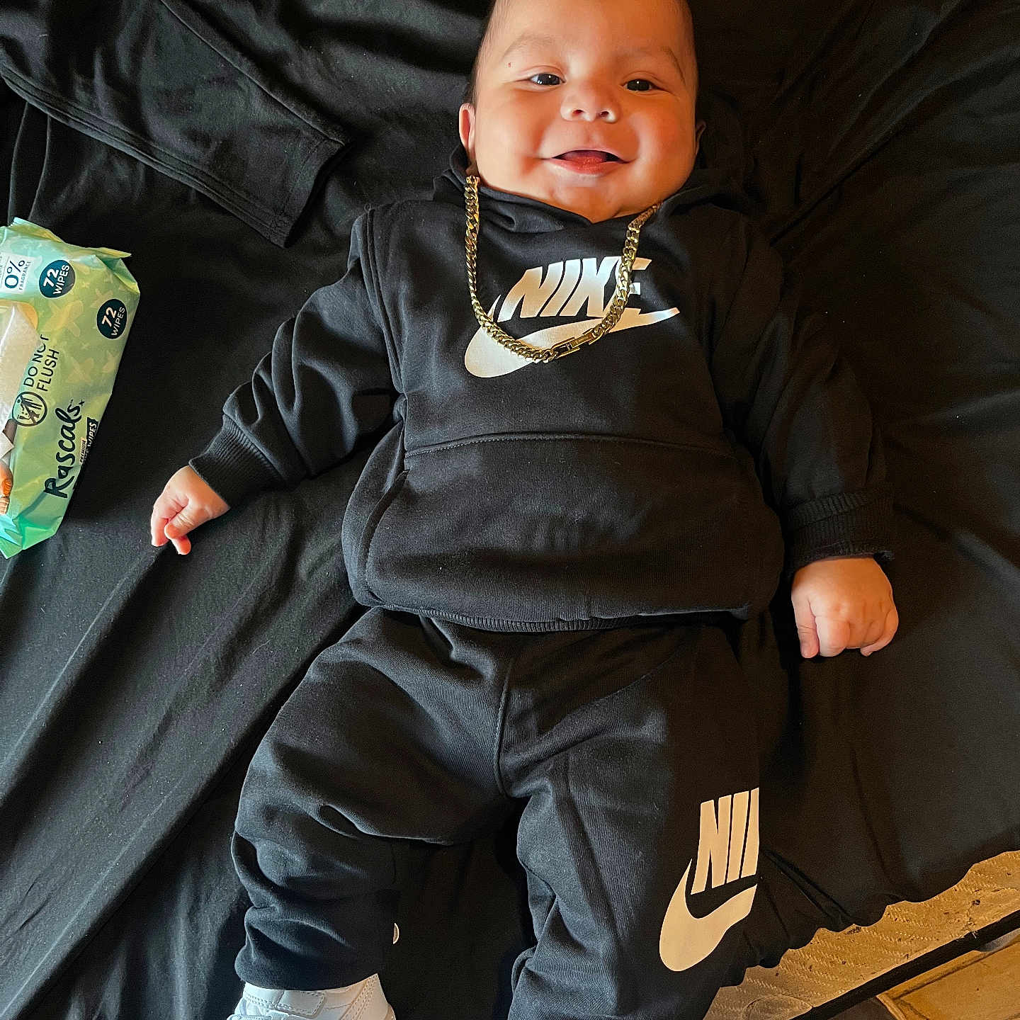 Scooter joined the competition — help win amazing prizes! baby, black_clothing, casual, child, cute, fashion, floor, footwear, gold_chain, happy, hoodie, indoors, lying_down, nike, pants, person, portrait, smiling, sneakers, wipes