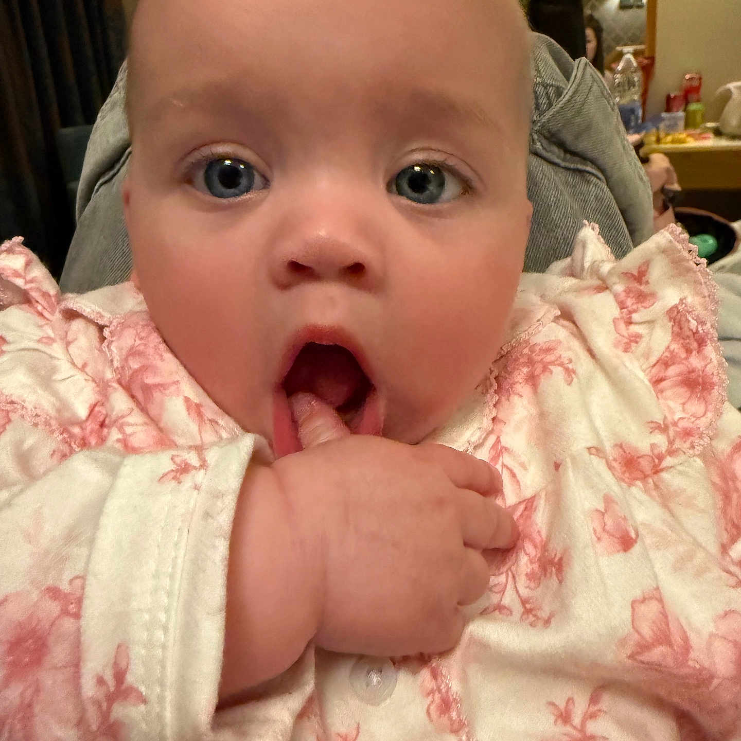 Harper Florence is registered to the contest to win money with this photo: baby, bodypart, clothing, coat, couch, cutlery, eating, face, finger, food, hand, head, jacket, lamp, mouth, newborn, person, photography, portrait, spoon