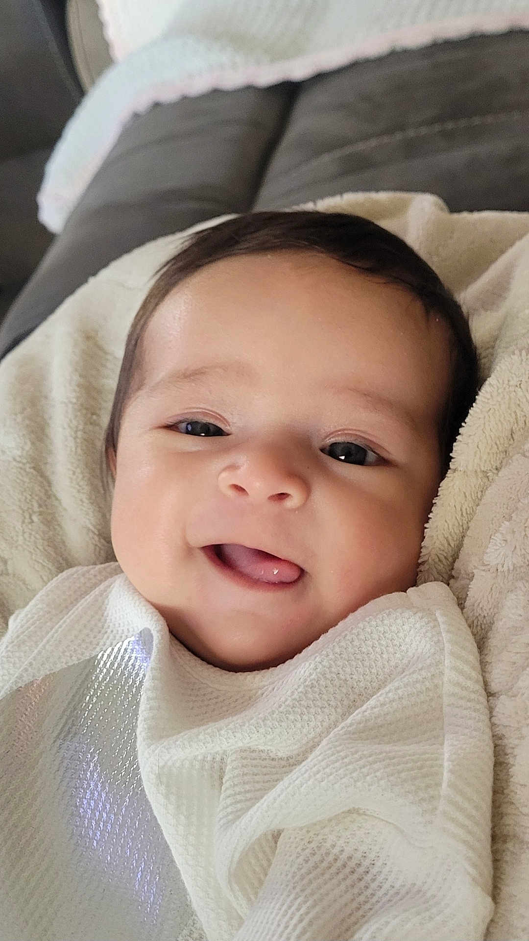 Addilynn joined the competition — help win amazing prizes! baby, babylaughing, bed, blanket, bodypart, cushion, face, furniture, happy, head, homedecor, laughing, mouth, newborn, person, photography, portrait, quilt, smile, teeth