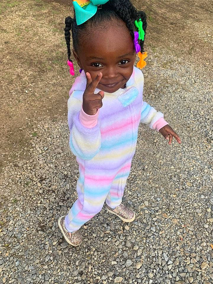 Trinity is registered to the contest to win money with this photo: adaptation, baby, child, fun, hair_accessory, hairstyle, happy, head, person, pink, plant, play, skin, smile, toddler, vacation