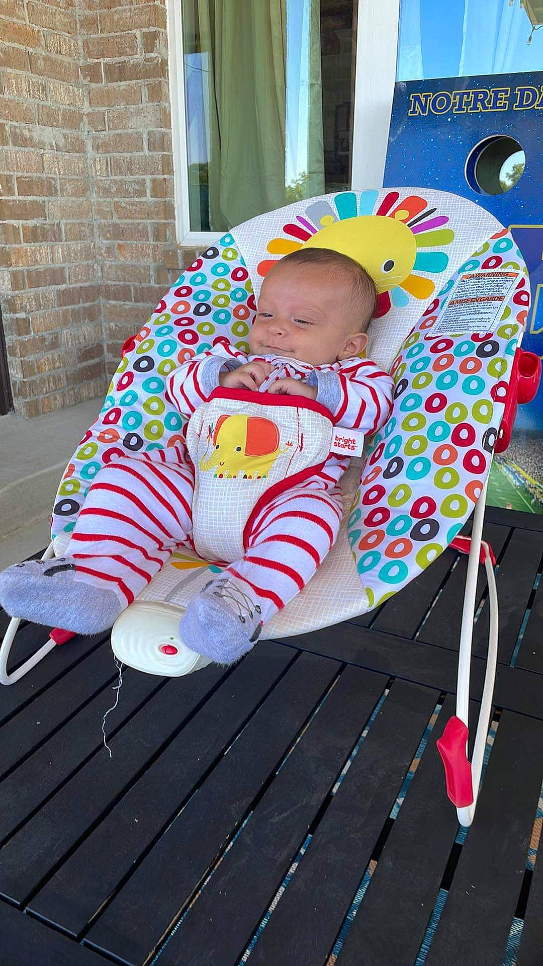 River joined the competition — help win amazing prizes! baby, baby_products, baby_toddler_clothing, brick, carmine, chair, child, comfort, event, fashion_accessory, fun, grass, hat, leisure, magenta, pattern, person, pink, play, sitting